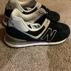 Black and white New Balance 574 trainers
